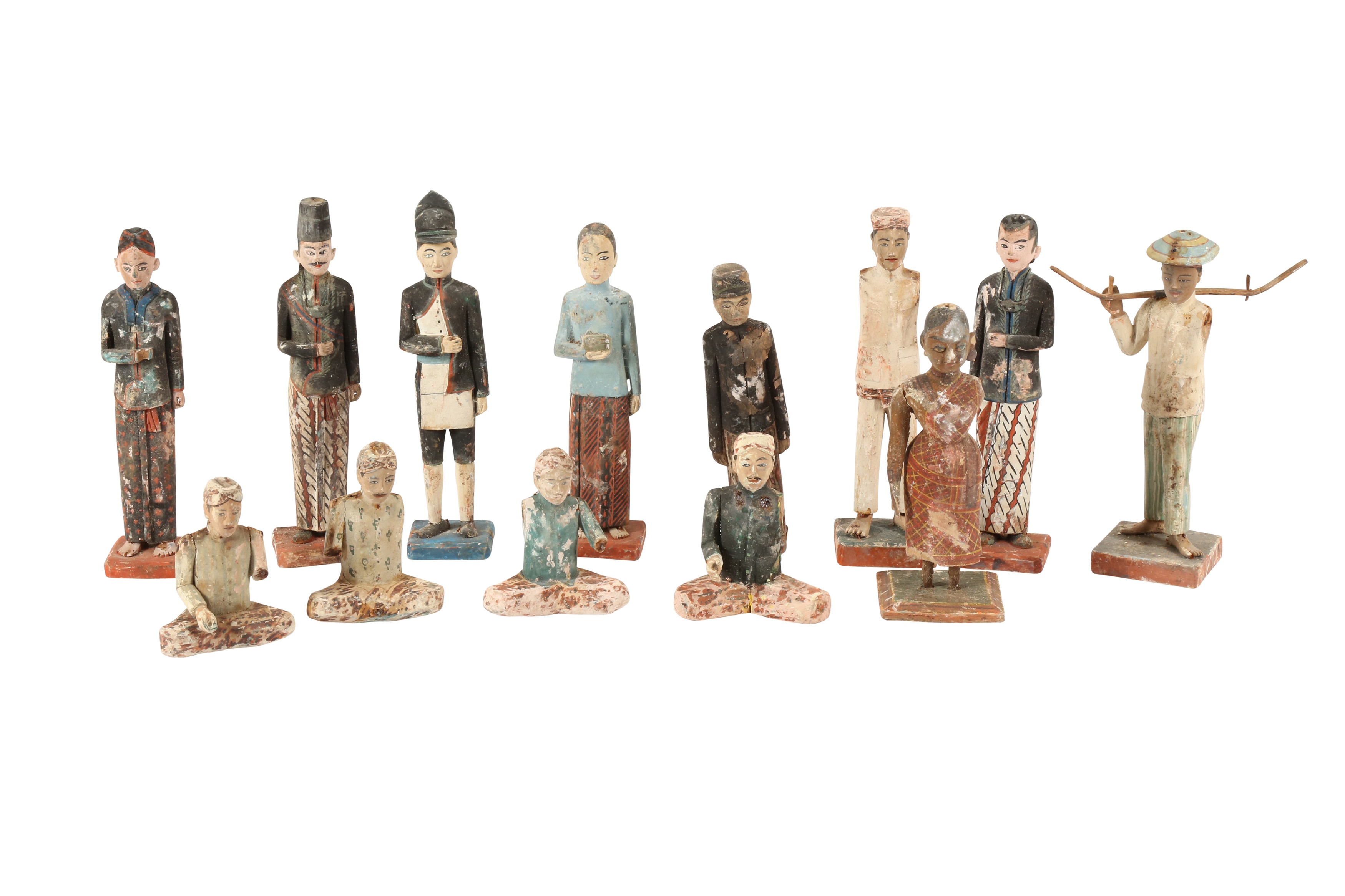 Lot 331 THIRTEEN POLYCHROMEPAINTED WOODEN FIGURINES