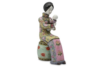 Lot 60 - A CHINESE FAMILLE ROSE FIGURE OF A MOTHER AND CHILD.