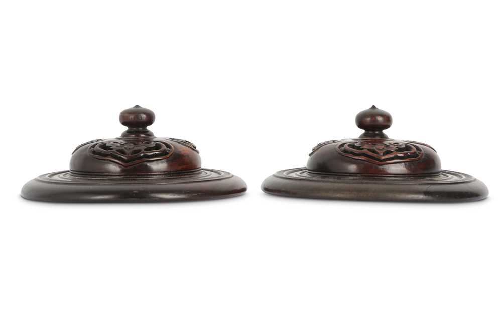 Lot 690 - A PAIR OF CHINESE WOOD COVERS.