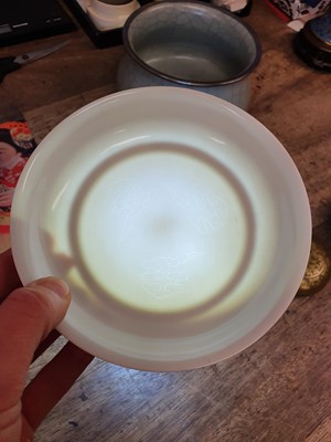 Lot 526 - A CHINESE ANHUA-DECORATED WHITE-GLAZED SAUCER.