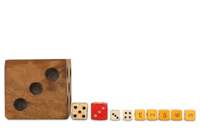 Lot 92 - AN OVER-SIZED CARVED AND STAINED WOODEN DICE TOGETHER WITH NINE OTHERS