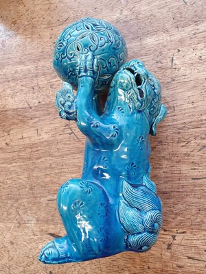 Lot 398 - A PAIR OF JAPANESE TURQUOISE-GLAZED LION DOGS.