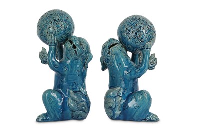 Lot 398 - A PAIR OF JAPANESE TURQUOISE-GLAZED LION DOGS.
