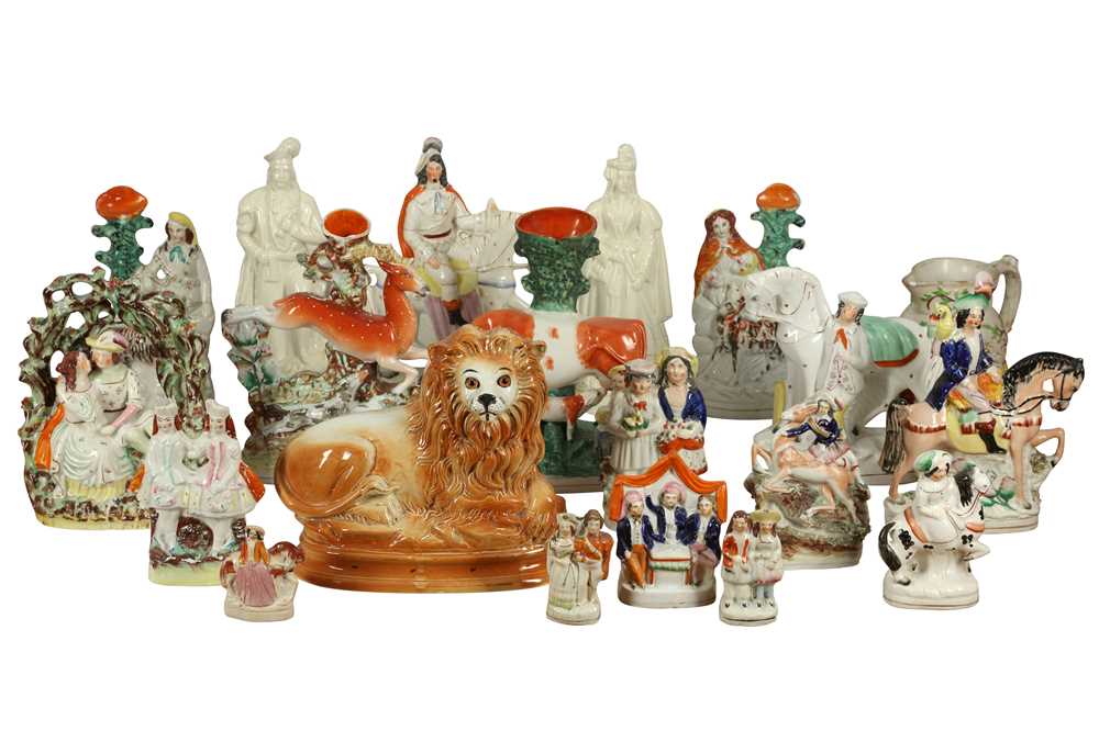 Lot 242 - A PAIR OF STAFFORDSHIRE FIGURES OF A HIGHLAND MAN AND HIS WIFE, 19TH CENTURY