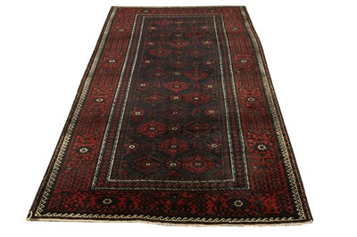 Lot 33 - AN ANTIQUE BALOUCH RUG, NORTH-EST PERSIA