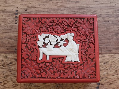 Lot 686 - A CHINESE CINNABAR LACQUER RECTANGULAR BOX AND COVER.