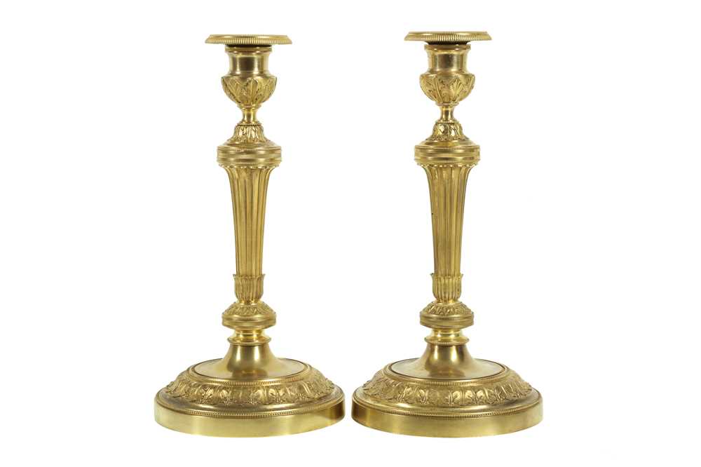 Lot 110 - A PAIR OF 19TH CENTURY FRENCH GILT BRONZE CANDLESTICKS AFTER THE MODEL BY CLAUDE GALLE, PARIS