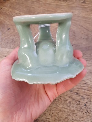 Lot 142 - A CHINESE CELADON-GLAZED 'BLOSSOM' STAND.