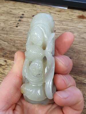 Lot 124 - A CHINESE PALE CELADON JADE 'BOYS AND ELEPHANT' GROUP.