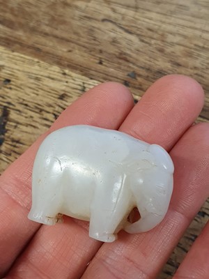 Lot 123 - A SMALL CHINESE WHITE JADE CARVING OF AN ELEPHANT.