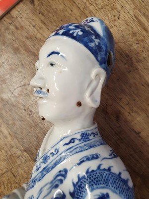 Lot 62 - A CHINESE BLUE AND WHITE FIGURE OF AN IMMORTAL.