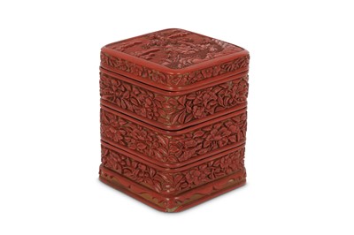 Lot 569 - A CHINESE CINNABAR LACQUER THREE-TIERED BOX AND COVER.