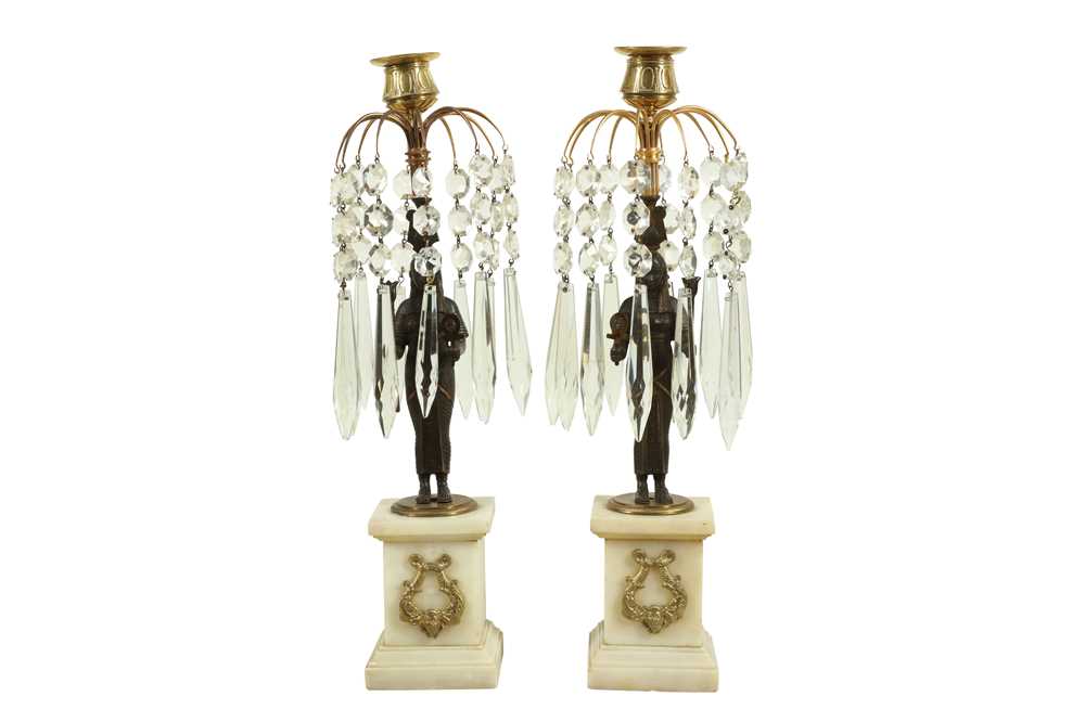 Lot 107 - A PAIR OF REGENCY EGYPTIAN REVIVAL BRONZE AND CUT GLASS CANDLESTICKS