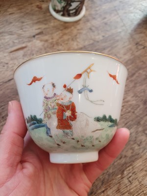 Lot 14 - A PAIR OF CHINESE FAMILLE ROSE 'NEW YEAR' CUPS.