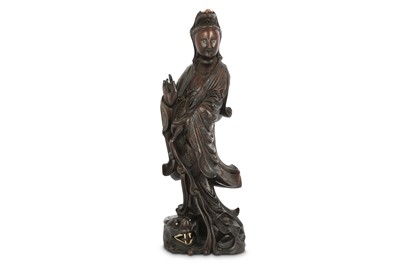 Lot 336 - A CHINESE HARDWOOD BONE AND WIRE-INLAID FIGURE OF GUANYIN.