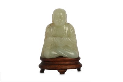 Lot 171 - A CHINESE PALE CELADON JADE CARVING OF A BUDDHA.