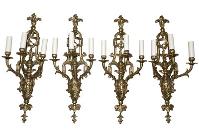 Lot 620 - A SET OF FOUR RENAISSANCE REVIVAL CAST BRASS WALL SCONCES