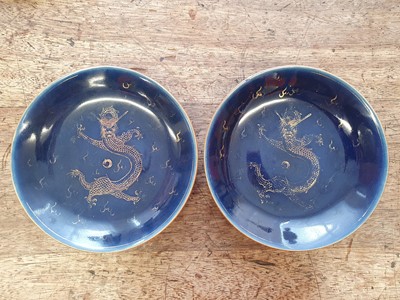 Lot 122 - A PAIR OF BLUE-GLAZED GILT-DECORATED 'DRAGON' DISHES.