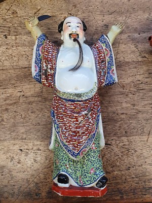 Lot 58 - A CHINESE FAMILLE ROSE FIGURE OF AN IMMORTAL.