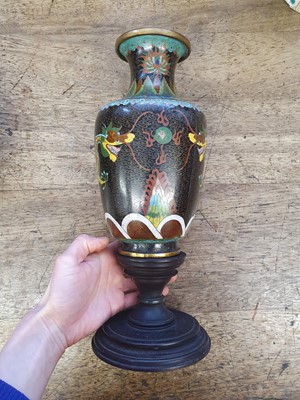 Lot 108 - A CHINESE CLOISONNE ENAMEL BLACK-GROUND VASE AND A JAR AND COVER.