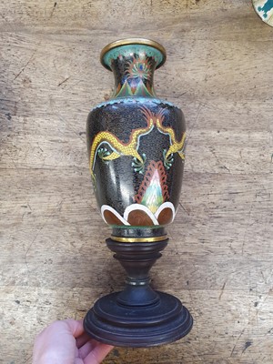 Lot 108 - A CHINESE CLOISONNE ENAMEL BLACK-GROUND VASE AND A JAR AND COVER.