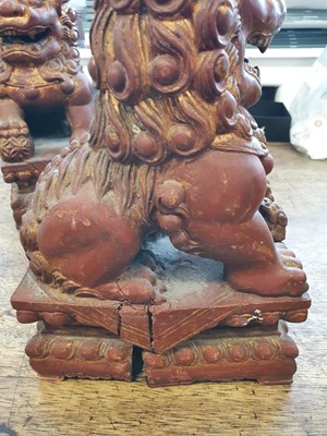 Lot 397 - A PAIR OF CHINESE RGILT-LACQUER LION DOGS.