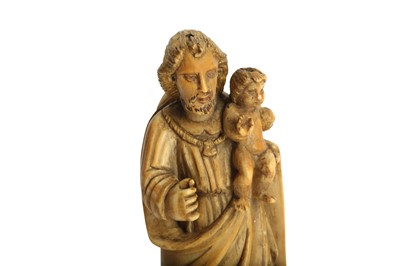 Lot 215 - λ A CARVED AND PAINTED IVORY STATUETTE OF ST. JOSEPH AND BABY JESUS