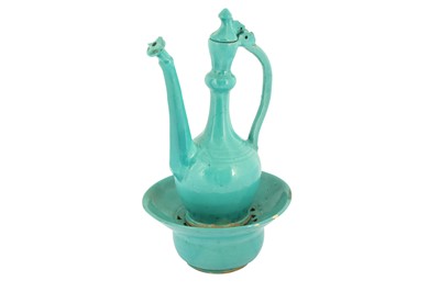 Lot 71 - A SAFAVID TURQUOISE MONOCHROME POTTERY EWER AND BASIN
