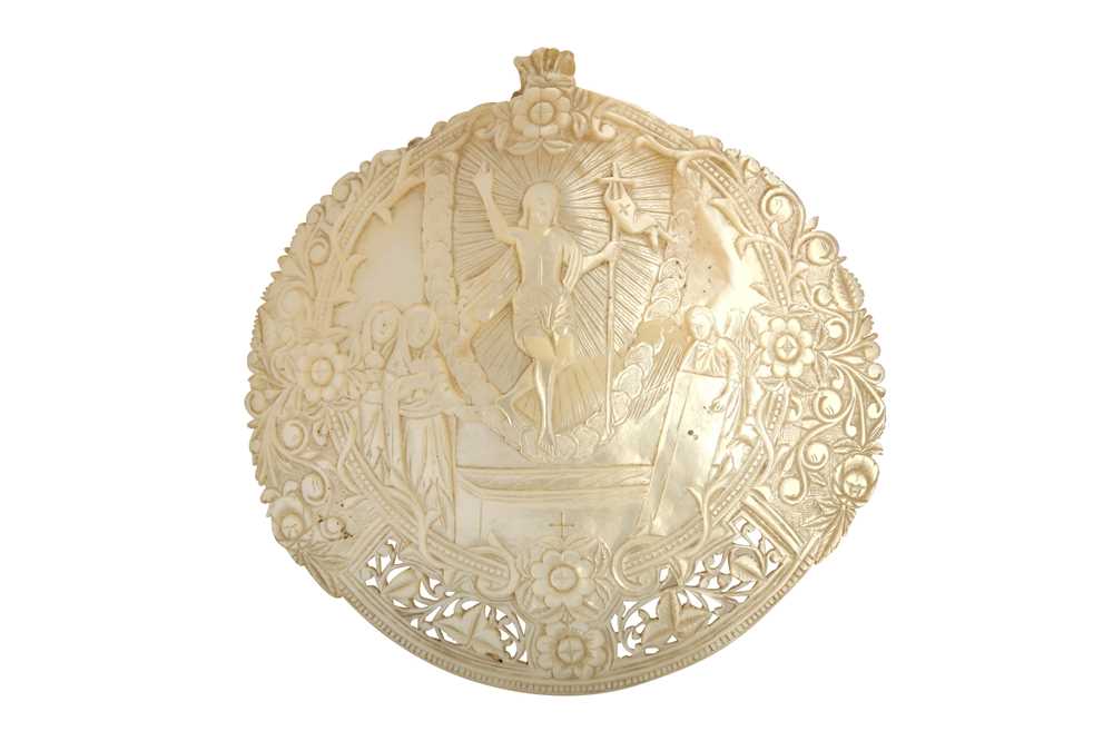 Lot 213 - λ A CARVED MOTHER-OF-PEARL SHELL PLAQUE