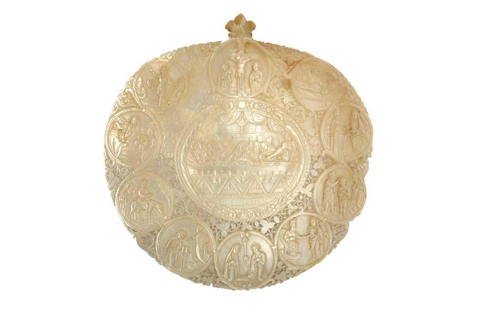 Lot 214 - λ A CARVED MOTHER-OF-PEARL SHELL PLAQUE