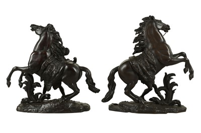 Lot 56 - AFTER GUILLAUME COUSTOU, FRENCH (1677-1746): A PAIR OF LATE 19TH CENTURY CENTURY PATINATED BRONZE MODELS OF THE MARLEY HORSES