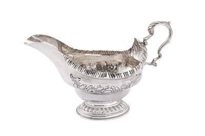 Lot 395 - An early George III Scottish sterling silver sauceboat, Edinburgh 1762 by James McKenzie I (possibly)