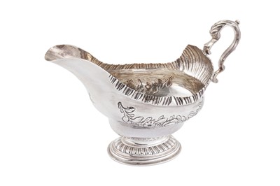 Lot 395 - An early George III Scottish sterling silver sauceboat, Edinburgh 1762 by James McKenzie I (possibly)
