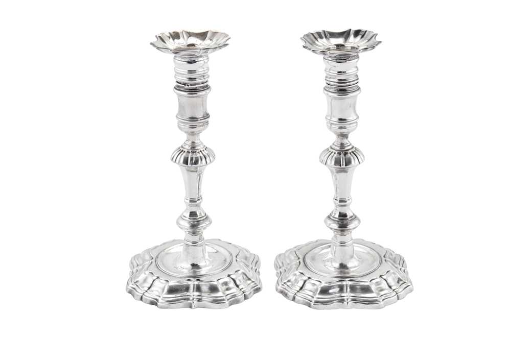 Lot 433 - A pair of George II sterling silver candlesticks, London 1735 by James Gould