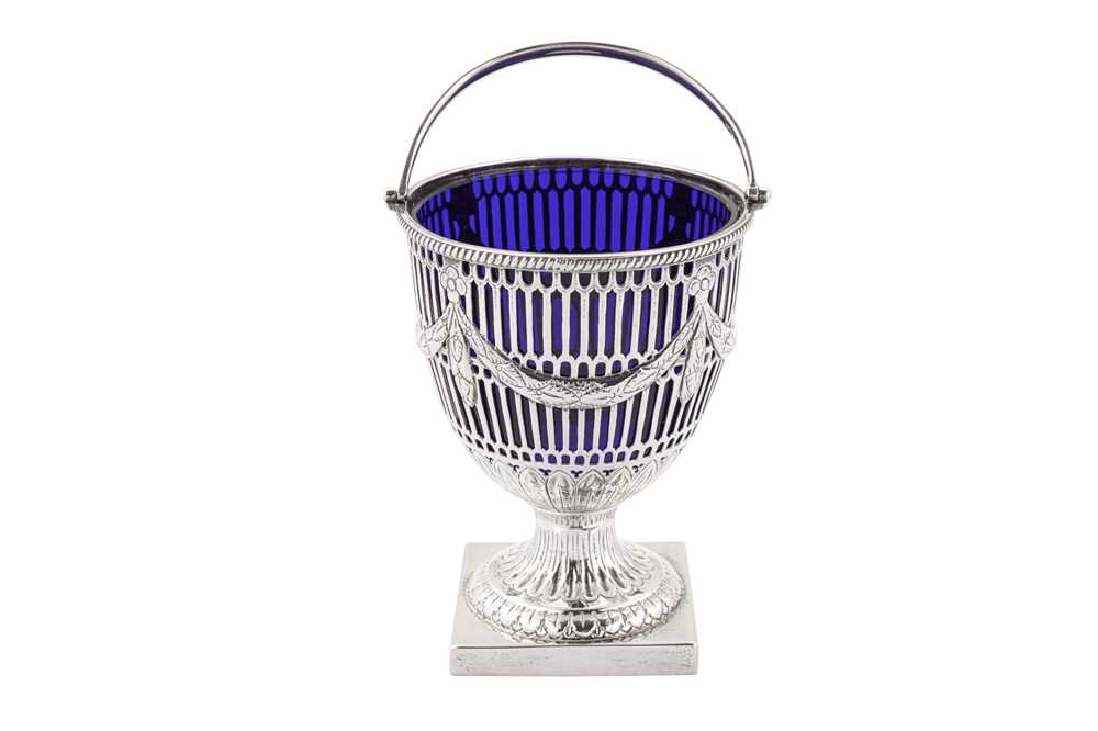 Lot 322 - An Edwardian sterling silver sugar basket, London 1907 by Carrington and Co