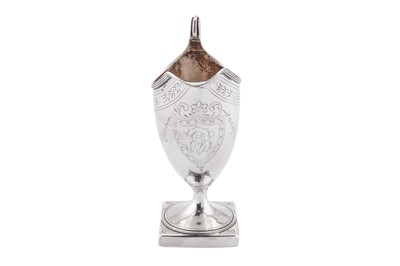 Lot 377 - A George III sterling silver helmet cream jug, London 1792 by Peter and Anne Bateman (reg. 2nd May 1791) overstruck by Thomas Ollivant of Manchester