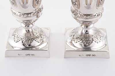 Lot 365 - A pair of Victorian sterling silver pepper casters, London 1880 by Robert Harper