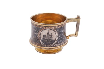 Lot 151 - An Alexander III Russian 84 zolotnik (875 standard) silver gilt and niello tea glass holder, Moscow 1883 by Vasily Semyonov (est. 1852)