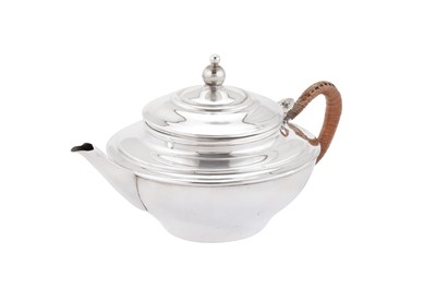 Lot 266 - A George V ‘Arts and Crafts’ sterling silver green tea teapot, London 1911 by William Arthur Smith Benson (1854-1924)