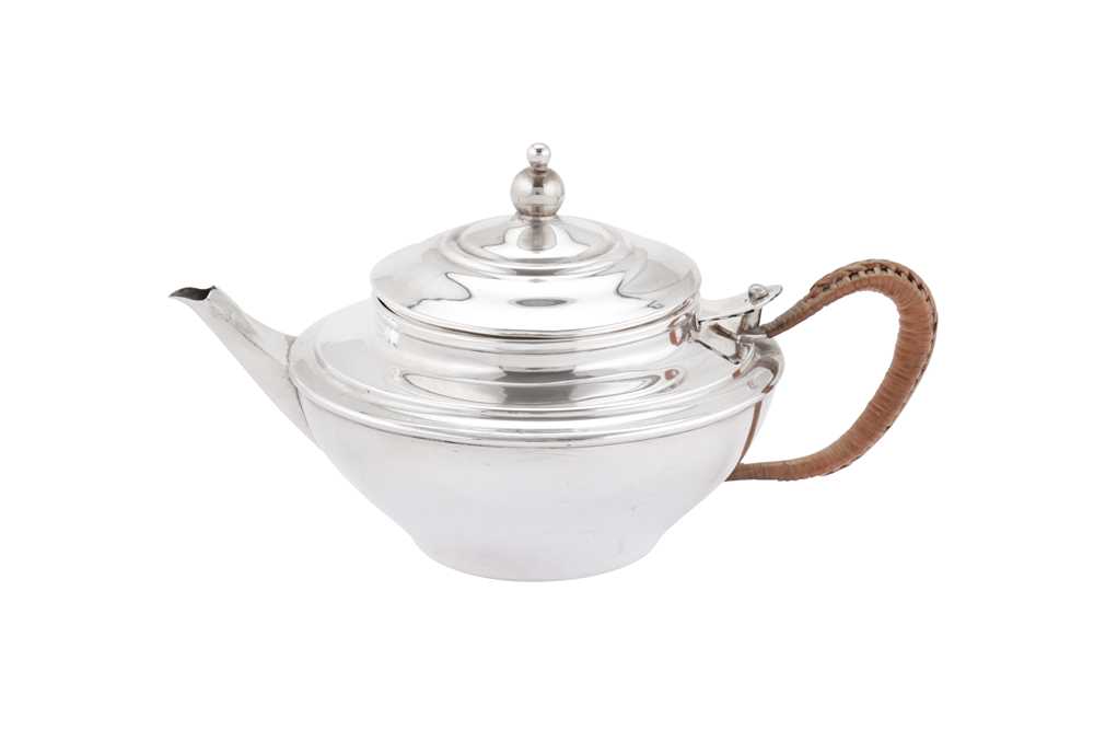 Lot 266 - A George V ‘Arts and Crafts’ sterling silver green tea teapot, London 1911 by William Arthur Smith Benson (1854-1924)