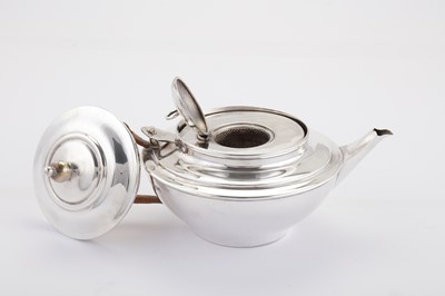 Lot 266 - A George V ‘Arts and Crafts’ sterling silver green tea teapot, London 1911 by William Arthur Smith Benson (1854-1924)