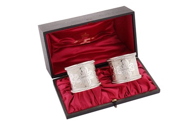 Lot 46 - A cased pair of Victorian sterling silver napkin rings, 1895 by Henry Atkin