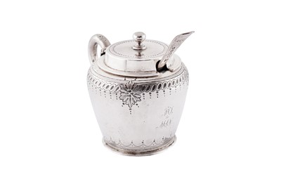 Lot 348 - A Victorian sterling silver mustard pot and spoon, Sheffield 1880 by Henry Wilkinson and Co