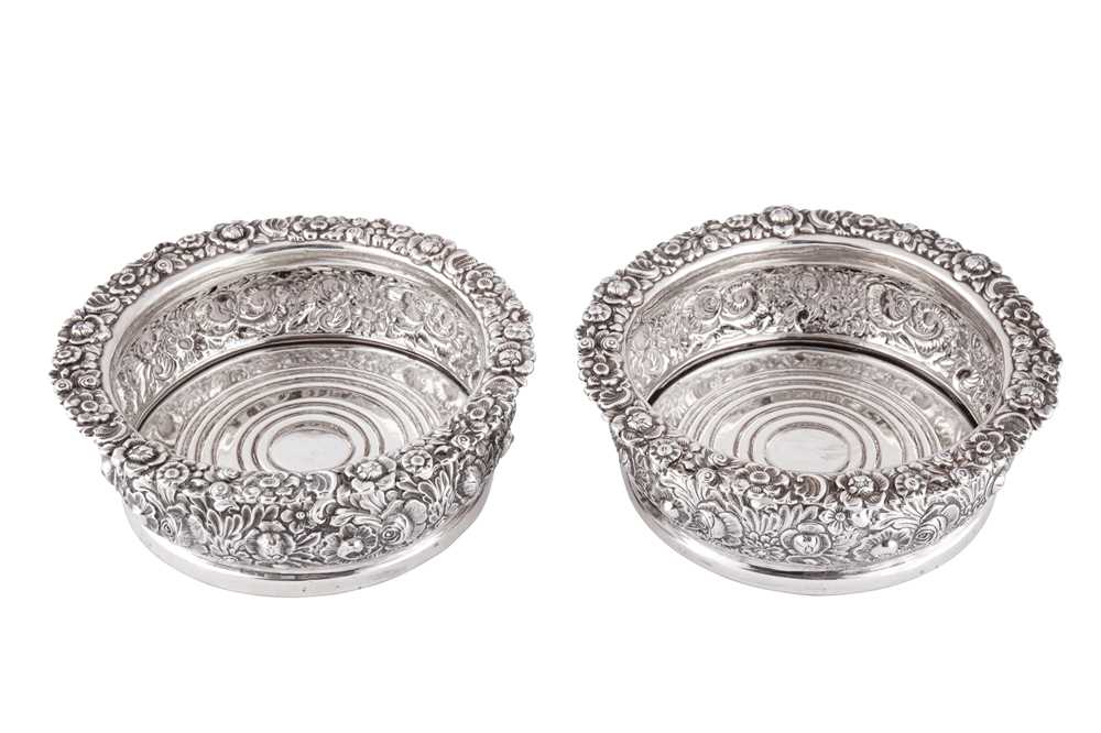 Lot 330 - A pair of Victorian sterling silver wine coasters, Sheffield 1865 by Henry Wilkinson and Co