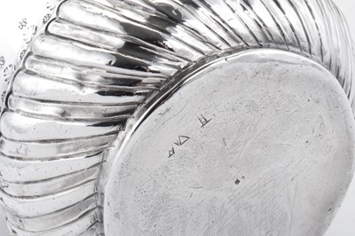 Lot 446 - A Queen Anne Britannia standard silver porringer, London 1713 by Nathaniel Lock, additionally struck AR crowned