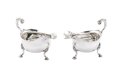 Lot 417 - A pair of early George III sterling silver sauceboats, London 1764 by William and James Priest (reg. after 1764)