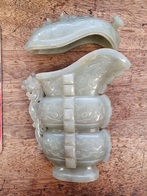 Lot 625 - A CHINESE PALE CELADON JADE ARCHAISTIC VESSEL AND COVER, GONG.