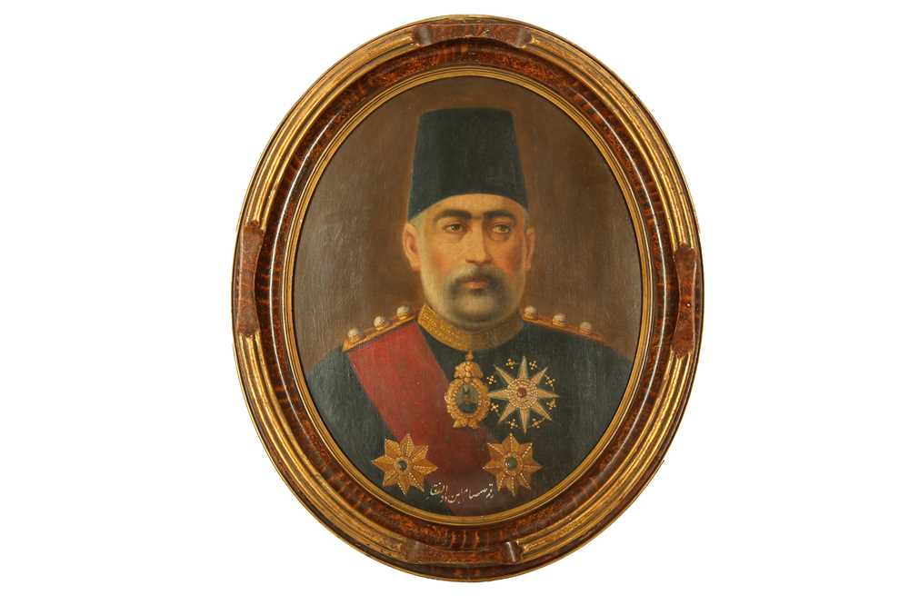 Lot 102 - AN OVAL PORTRAIT OF MIRZA 'ALI ASGHAR KHAN AMIN AL-SOLTAN (1858 - 1907)