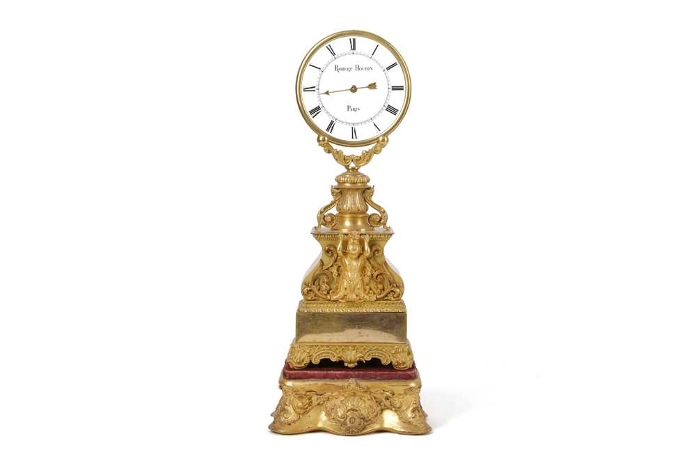 A MID 19TH CENTURY FRENCH GILT BRONZE AND GLASS MYSTERY CLOCK ATTRIBUTED TO...