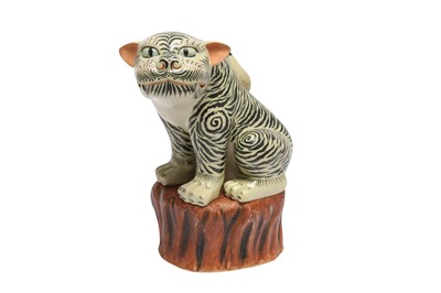 Lot 854 - A JAPANESE BISCUIT FIGURE OF A TIGER.